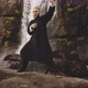 Kung Fu Master Performing Martial Arts By Waterfall
