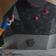 Young Climber Training on a Climbing Wall Practicing Rockclimbing and Moving Up - VideoHive Item for Sale