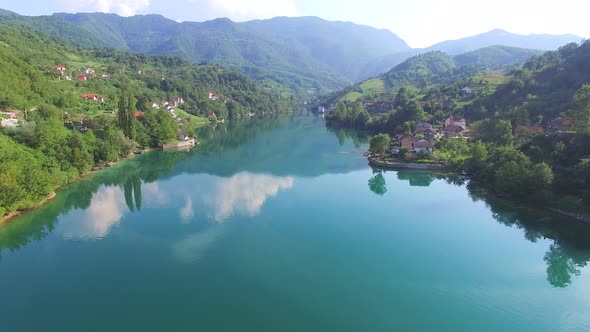 Flying over clear river in Bosnia alt