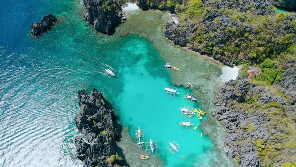 Aerial Top Down Circle Footage of Boat Inside of Small Lagoon in ElNido Tour A Palawan alt