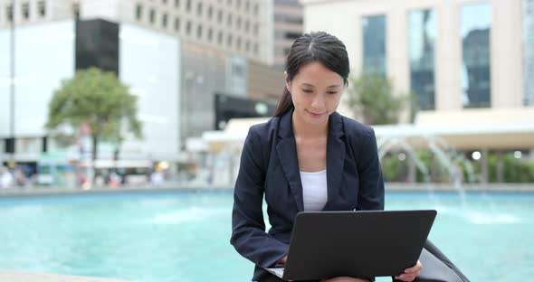 Businesswoman work on laptop computer at outdoor alt