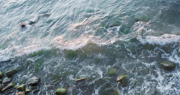 Sea Surf. Waves on Beach with Rocks. Baltic Sea, Kaliningrad Oblast, Russia.