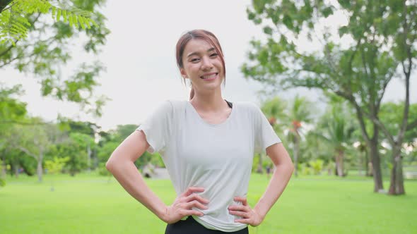 Portrait of beautiful girl in sportswear smile, and look at camera after running workout. alt