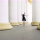 Camera Approaches To Slim Confident Ballerina Dancing Between White Columns - VideoHive Item for Sale
