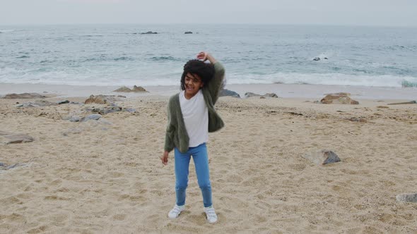 Small Funny Girl Is Dancing On Beach