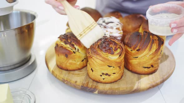 a Female Cook Lubricates with Melted Butter a Kraffin Easter Cake alt