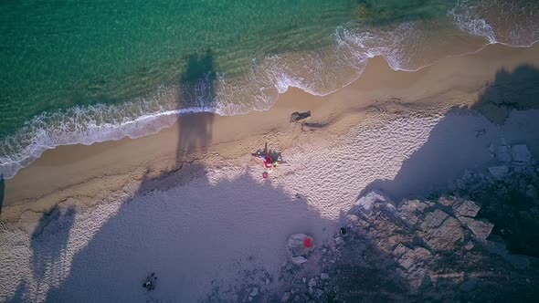 Beautiful Beach with Family Top Aerial View Drone Shot