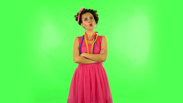 Lovely Girl Listens Carefully To Boring Information and Looks Around on Green Screen alt