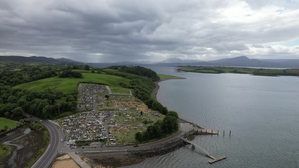 Cemetery overlooking sea near Bantry west County Cork, Ireland aerial drone view alt