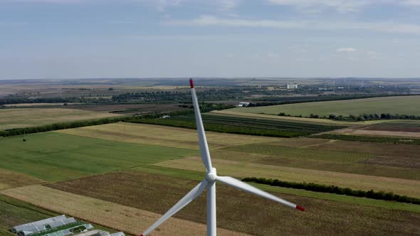 Windmill aerial view in 4K energy production wind power turbine alt