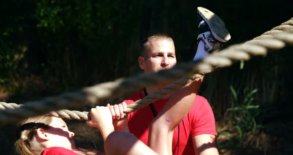 Trainer training kids in the boot camp alt