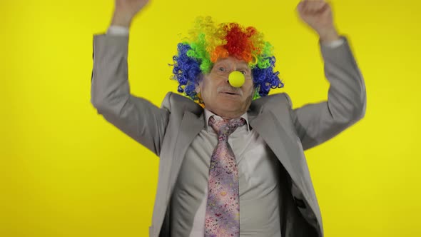 Elderly Clown Businessman Entrepreneur Dancing, Celebrate, Making Silly Faces alt