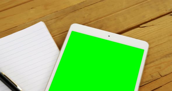 Digital tablet, organizer and pen on table 4k alt