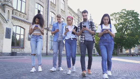 Group of no talking people walking at the street