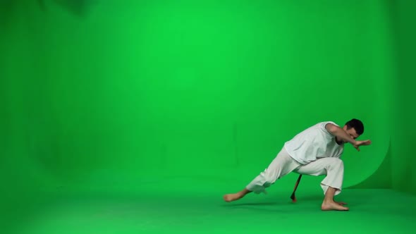 Man Practicing Capoeira on Chroma Key Studio. Slow Motion. alt
