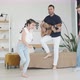 Dad Plays the Guitar and the Children Dance at Home in the Living Room Energetic Children - VideoHive Item for Sale