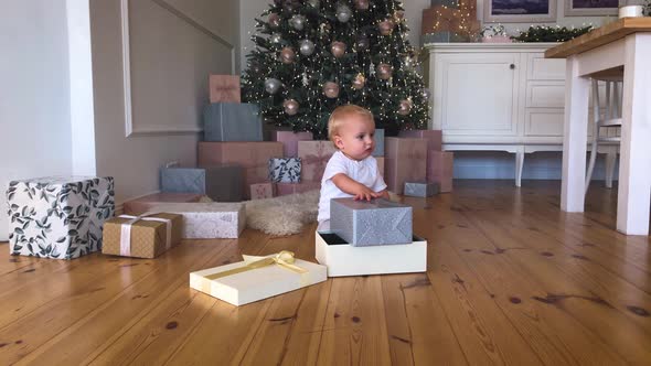 Mother's Christmas Mood with Her Child, Near the New Year Tree. Winter Holidays