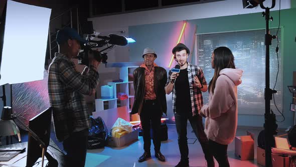 Young Reporter Taking Interview for Mass Media with Stars of the New Movie alt