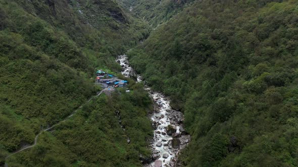 Aerial drone shot of a white water river inside the Annapurna mountains, Nepal alt