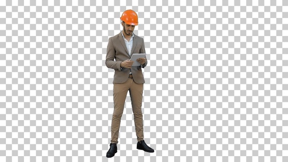 Young manager in helmet holding tablet, Alpha Channel