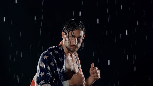 Victorious Man In The Rain With American Flag alt