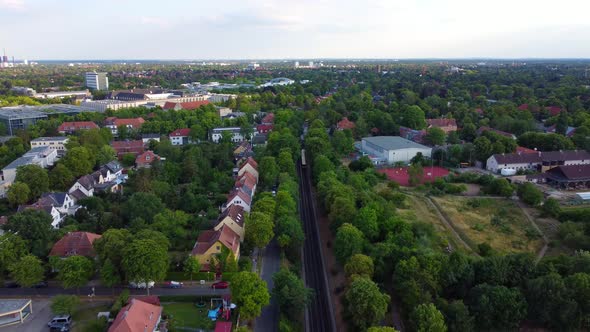 Railroad tracks with yellow moving subway trainPerfect aerial view flight panorama overview drone f alt