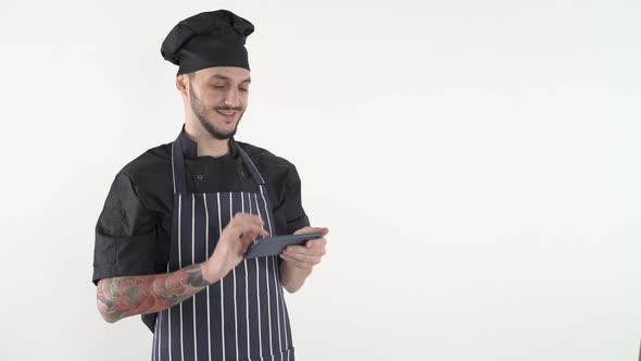 Chef Uniform Typing Smartphone Against White Background alt