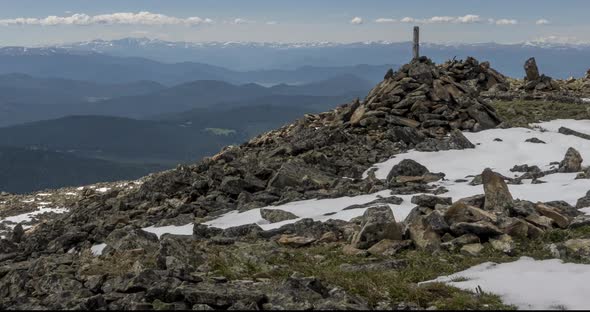 Time Lapse of Cloudscape Behind of the Mountains Top alt
