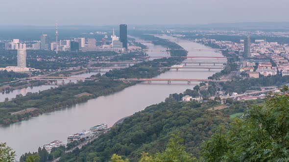 Skyline of Vienna From Danube Viewpoint Leopoldsberg Aerial Day to Night Timelapse alt