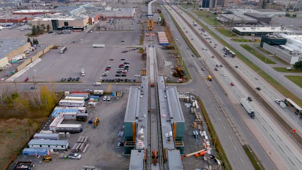 4K camera drone view of the construction site of the new Fairview Station of the REM in Montreal.