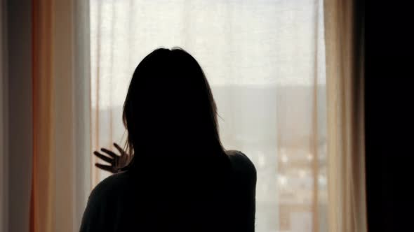 Woman in Hotel Room Opens Curtains and Walks Balcony Beautiful City View alt