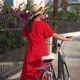Tracking Shot of Confident Female Biker Walking with Bicycle in Slow Motion on Sunny Street on - VideoHive Item for Sale