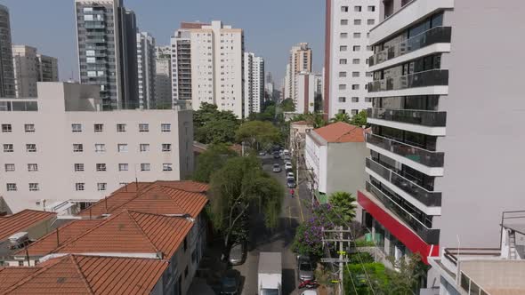 Drone Image, Flying Over A Calm Street, Cars Passing By