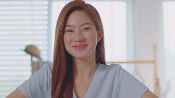 Beautiful Asian young woman making okay and laughing happiness and cheerful