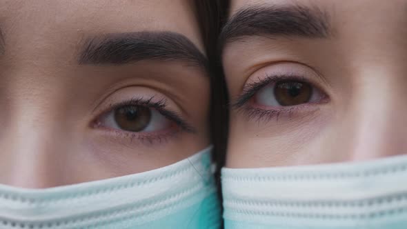 Portrait two caucasian twin girls in medical protective face mask. Outbreak of coronavirus COVID-19. alt