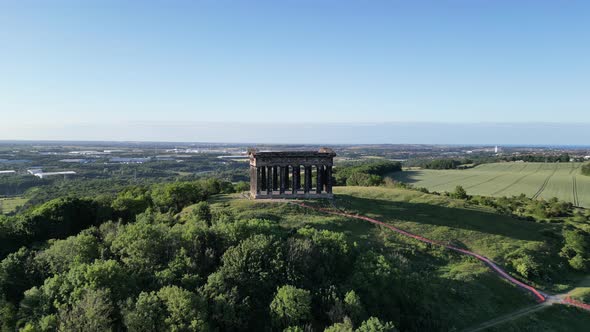 Aerial wide cinematic, camera pulls back and rises up on Penshaw Monument in Sunderland, North East, alt