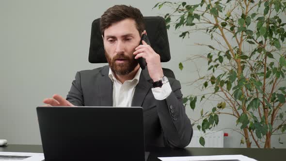 Male Worker Answering on Phone Call alt