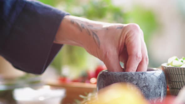 Hands of Male Cook Adding Salt into Bowl and Stirring with Whisk alt