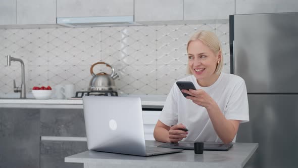 Blonde Woman Freelancer Records Voice Message or Uses Virtual Assistant at Home alt