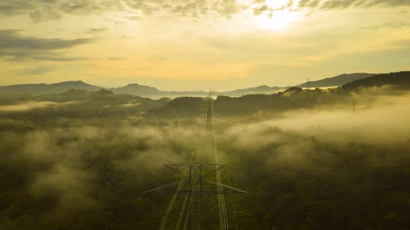 Aerial views, mountains and clouds with High-voltage power pole, alt