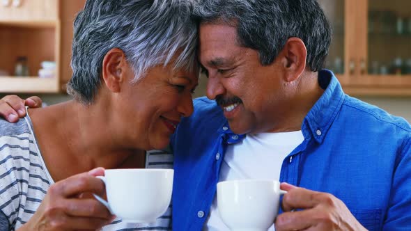 Senior couple having coffee at home 4k alt