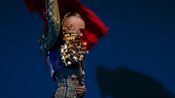 Torero in Blue and Gold Suit or Typical Spanish Bullfighter Isolated Spotlight on a Blue Background alt