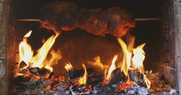 chicken roasting on a spit alt