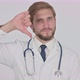 Thumbs Down By Young Doctor on White Background - VideoHive Item for Sale