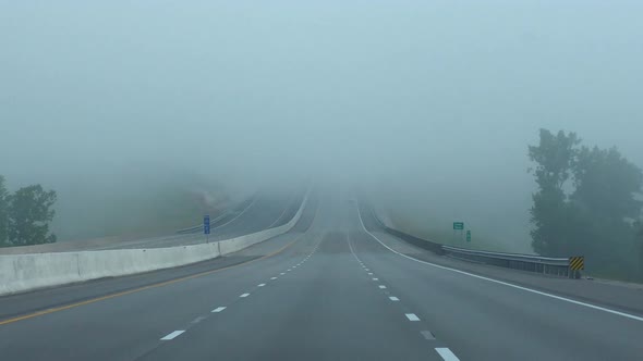 driving a car on a foggy mountain road
