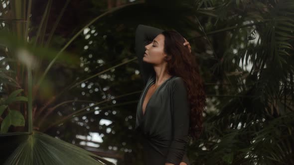Woman Standing in the Tropical Jungle at Summer alt