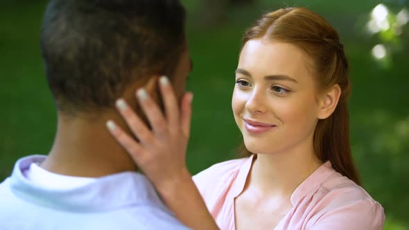 Teen Girlfriend Touching Cheek of Afro-American Boyfriend, Moment ...