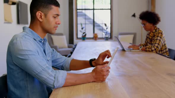 Caucasian Businessman using digital tablet in a modern office 4k