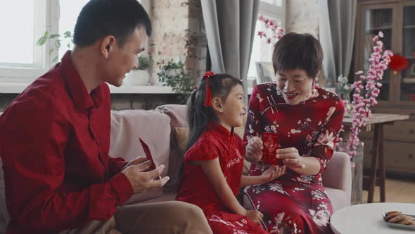 Happy Asian Family Celebrating Chinese New Year alt