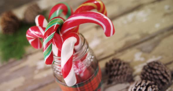 Candy canes arranged in a jar 4k alt